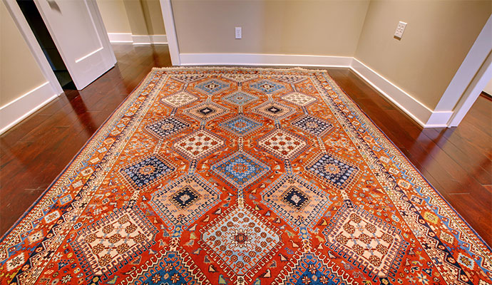 Cleaning a dirty rug using a disc machine.