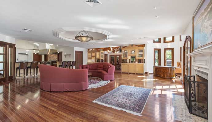  a living area and kitchen with glossy laminate flooring