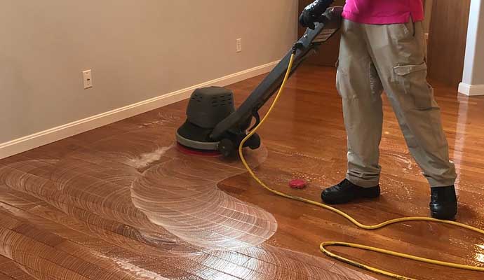 wood floor cleaning using a floor buffer machine