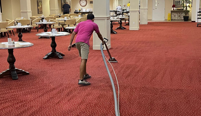 Cleaning carpeted floor of a commercial space