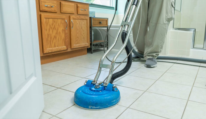 Professional cleaning floor using equipment.